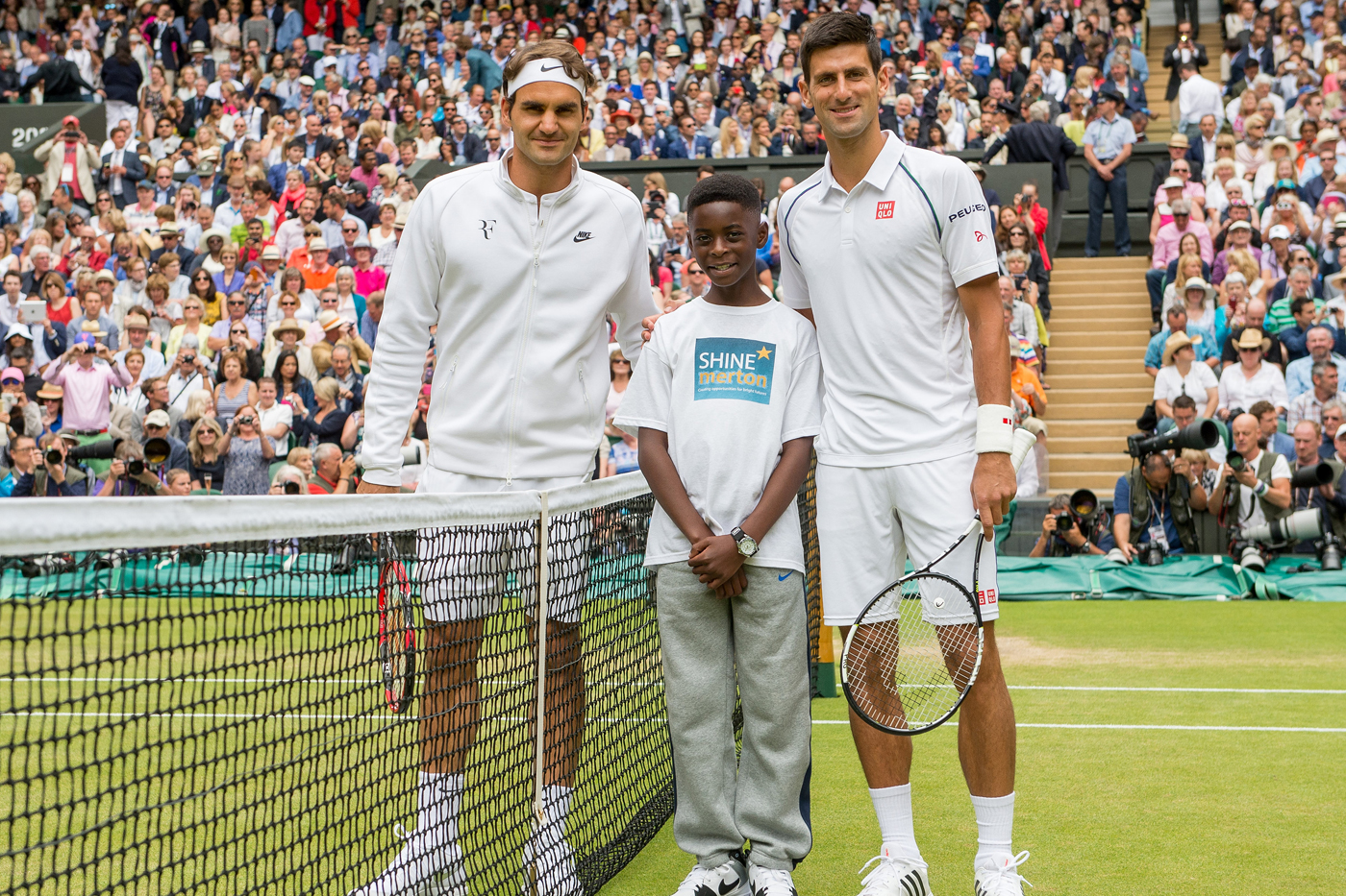 Michael Ntim of Shine Merton with Roger Federer and Novak Djokovic
