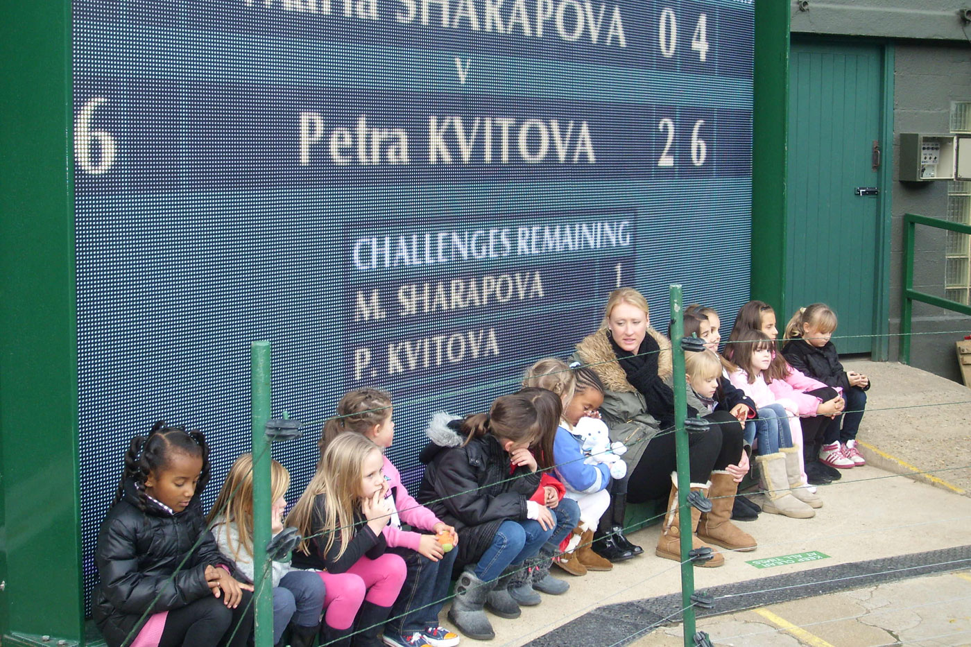 Elena Baltacha and juniors from her academy visit Centre Court.