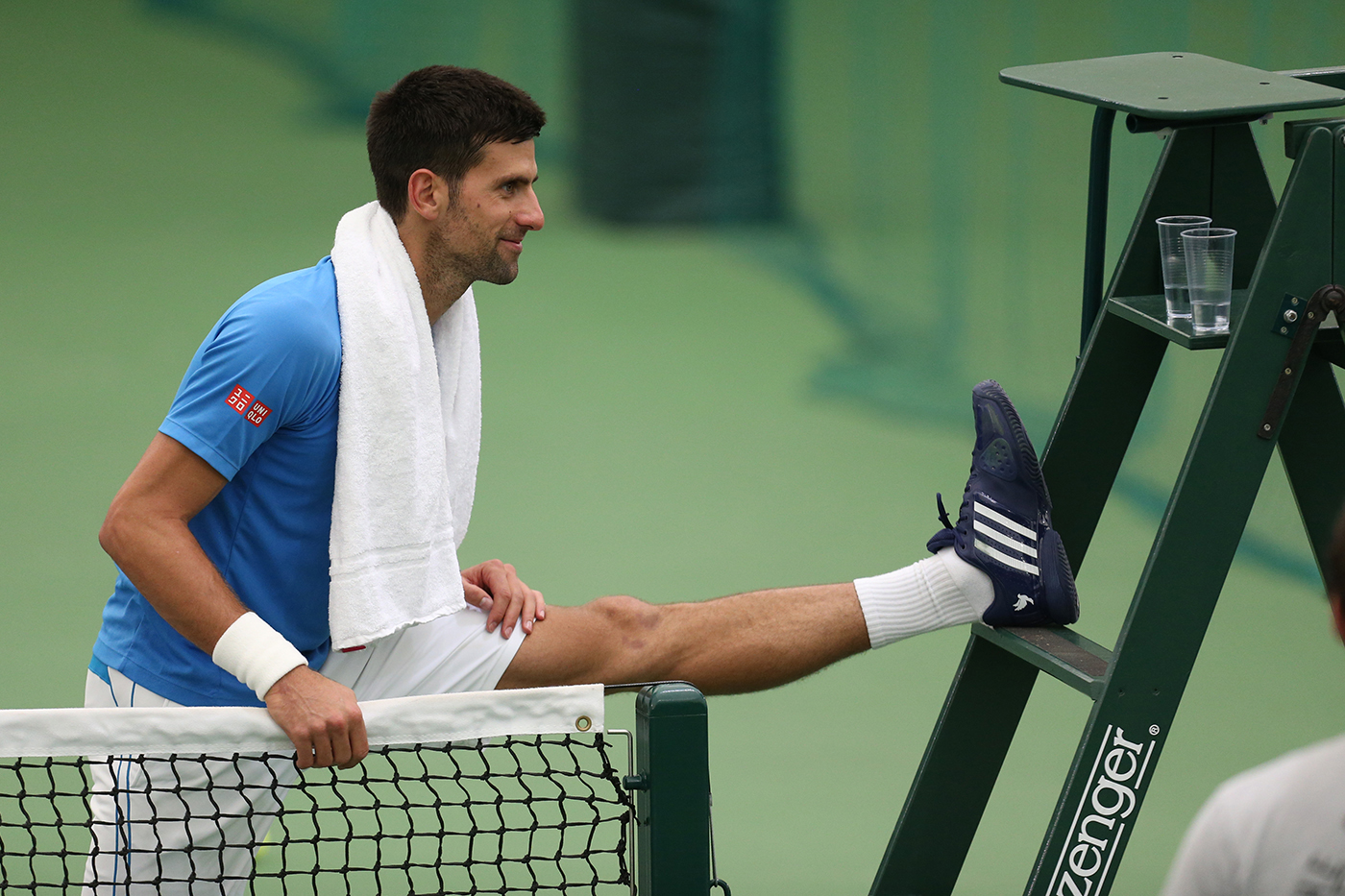 Novak Djokovic stretches during a practice session at Wimbledon.
