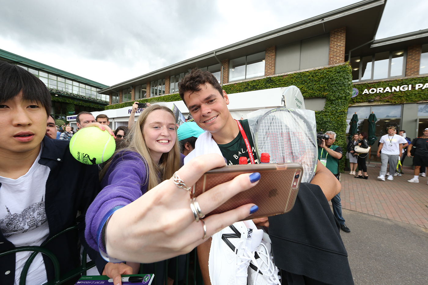 Milos Raonic poses for his tennis fans at Wimbledon. 